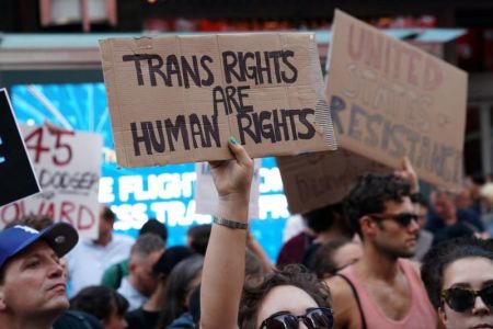 People protest U.S. President Donald Trump's announcement that he plans to reinstate a ban on transgender individuals from serving in any capacity in the U.S. military, in Times Square, in New York City, New York, U.S., July 26, 2017.