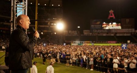 Evangelist Greg Laurie speaks to those who made 'decisions for Christ' during the 28th annual SoCal Harvest at Angel Stadium in Anaheim, California on Aug. 19, 2017.