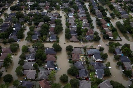 Houses are seen submerged in flood waters caused by Tropical Storm Harvey in Northwest Houston, Texas, U.S. August 30, 2017.