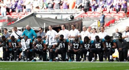 Jacksonville Jaguars players kneel during the U.S. national anthem before the match. September 24, 2017.