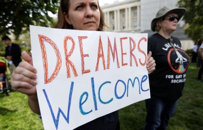 A woman holds a sign during a rally calling for the passage of a clean Dream Act outside the U.S. Capitol in Washington, U.S., September 26, 2017.