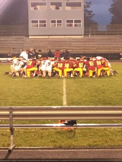 Bridgeport High School junior varsity football players pray with coaches and opponents in this photo posted to Facebook on September 7, 2017.