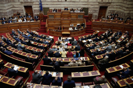 Greek Prime Minister Alexis Tsipras addresses lawmakers before a parliamentary vote of a law that allows citizens to declare a gender change on official documents in Athens, Greece October 10, 2017.