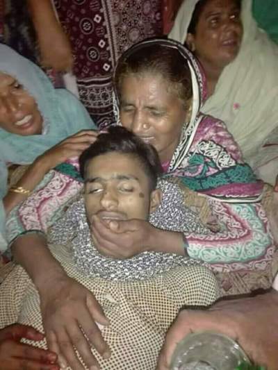 Family mourns over the body teenager Arslan Masih who was beaten to death by police officers in the Punjab province of Pakistan in October 2017.