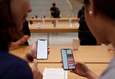 People look at iPhone X during its launch at the Apple store in Singapore November 3, 2017.