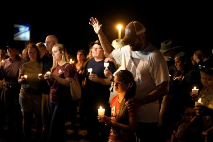 Ramiro and Sofia Martinez attend a candle light vigil after a mass shooting at the First Baptist Church in Sutherland Springs, Texas, U.S., November 5, 2017.