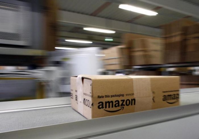 A parcel moves on the conveyor belt at Amazon's logistics centre in Graben near Augsburg December 16, 2013.