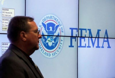 A Federal Emergency Management Agency employee waits for the arrival of U.S. President Donald Trump during a visit at FEMA headquarters in Washington, U.S., August 4, 2017.