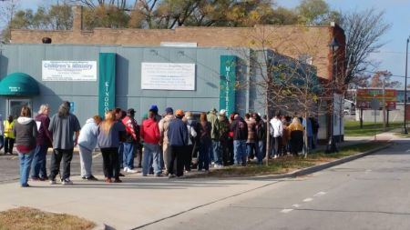 People line up for Advancing Christ's Kingdom Ministries' annual turkey giveaway in Michigan City, Indiana.