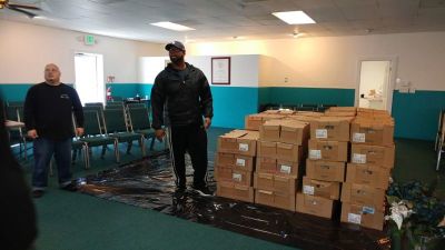 Volunteers stand by the boxes of turkeys that Advancing Christ's Kingdom Ministries of Michigan City, Indiana.