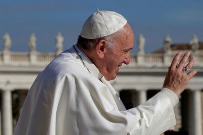 Pope Francis waves at the end of the Wednesday general audience in Saint Peter's square at the Vatican November 22, 2017.