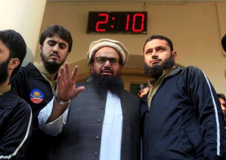 Hafiz Saeed speaks with supporters after attending Friday Prayers in Lahore, Pakistan, November 24, 2017.