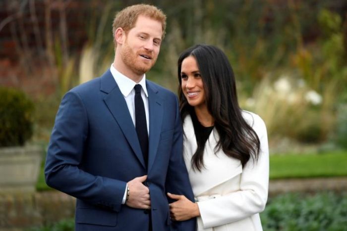 Britain's Prince Harry poses with Meghan Markle in the Sunken Garden of Kensington Palace, London, Britain, November 27, 2017.