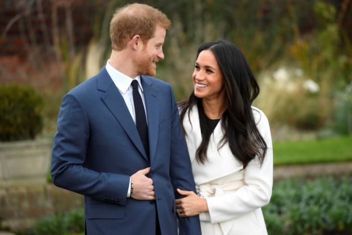 Britain's Prince Harry poses with Meghan Markle in the Sunken Garden of Kensington Palace, London, Britain, November 27, 2017.