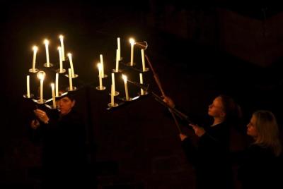 Candles are lit as Salisbury Cathedral celebrates the beginning of Advent with a candle lit service and procession, 'From Darkness to Light', in Salisbury, Britain November 27, 2015.