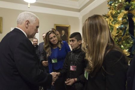 Iraqi Christian boy Noeh, 12, shakes Vice President Donald Trump's hand at the White House on Dec. 13, 2017.