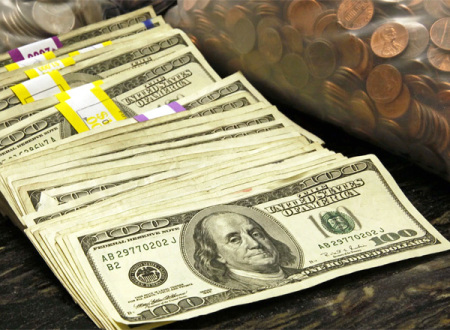 U.S. currency and coins in a vault at a bank in Westminster, Colorado.