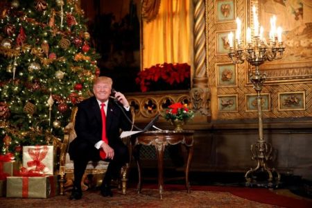 U.S. President Donald Trump participates in NORAD (North American Aerospace Defense Command) Santa Tracker phone calls with children at Mar-a-Lago estate in Palm Beach, Florida, U.S., December 24, 2017.