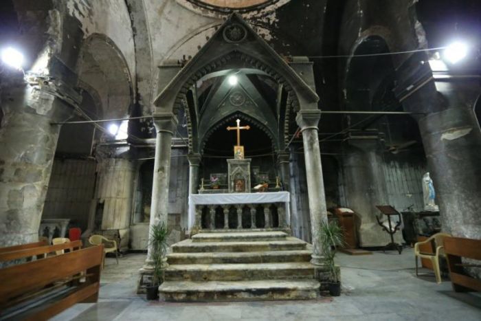 A burned church of the Immaculate Conception by Islamic State militants is seen in the town of Qaraqosh, south of Mosul, Iraq, December 23, 2017.