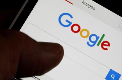 A man holds his smartphone which displays the Google home page, in this picture illustration taken in Bordeaux, Southwestern France, August 22, 2016.