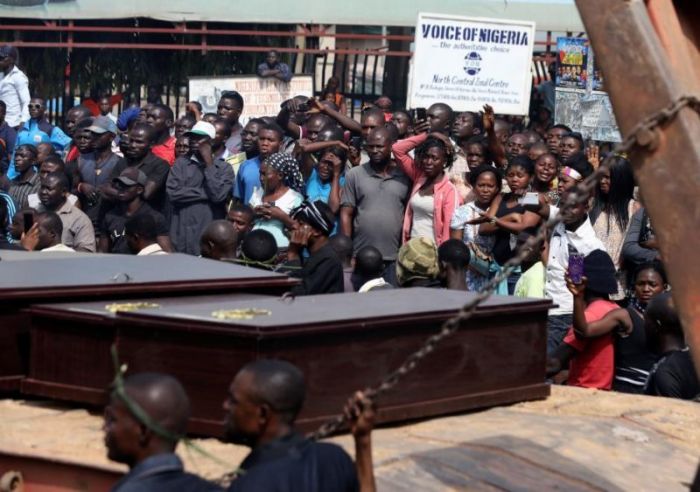 People react as a truck carries the coffins of people killed by the Fulani herdsmen, in Makurdi, Nigeria, January 11, 2018.