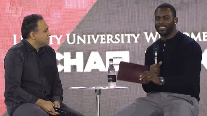 Former NFL quarterback Michael Vick (R) speaks during Liberty University's convocation in Lynchburg, Virginia on Jan. 29, 2018.