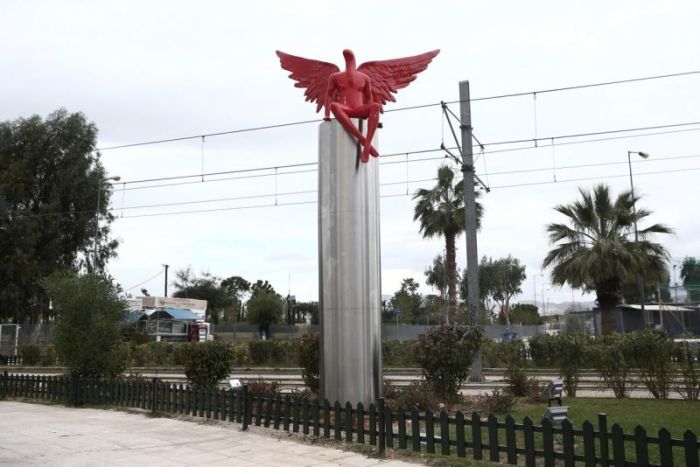 A red statue called Phylax by Greek artist Kostis Georgiou is seen in southern Athens, Greece, December 28, 2017.