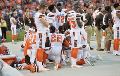 Members of the Cleveland Browns kneel during the national anthem before a game against the New York Giants at FirstEnergy Stadium.