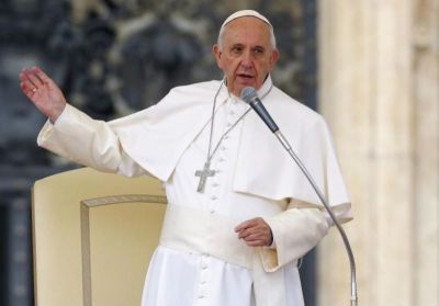 Pope Francis talks as he leads the weekly audience in Saint Peter's Square at the Vatican.