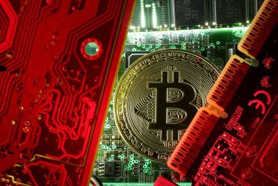 A copy of bitcoin standing on PC motherboard is seen in this illustration picture, October 26, 2017.