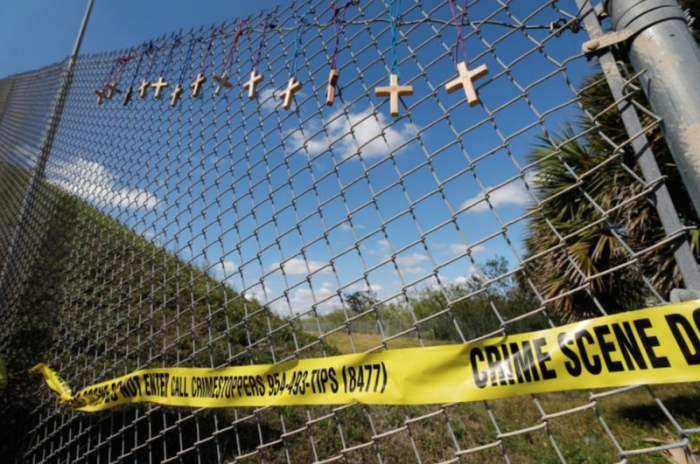 Crosses for the victims of yesterday's shooting at Marjory Stoneman Douglas High School hang on a fence a short distance from the school in Parkland, Florida, U.S., February 15, 2018.