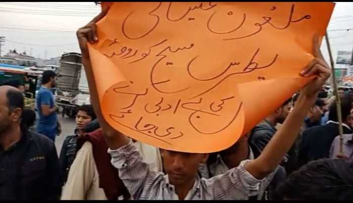 An angry mob calls for the lynching of Christian teenager Patras Masih in Lahore, Pakistan on Feb. 19, 2018.