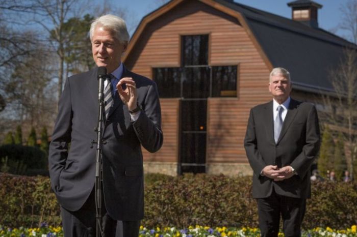 Former President Bill Clinton attends the lie in repose of Billy Graham in Charlotte, visiting with Franklin Graham at the Graham Family Homeplace on February 27, 2018.