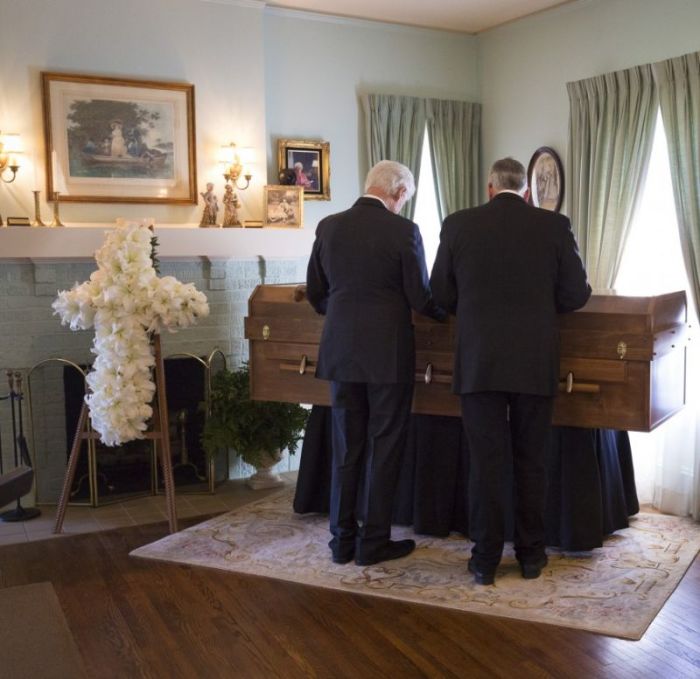 Former President Bill Clinton attends the lie in repose of Billy Graham in Charlotte, visiting with Franklin Graham at the Graham Family Homeplace on February 27, 2018.