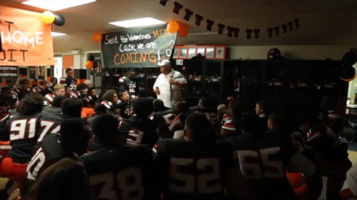 Rev. Mike Keahbone addresses the Putnam City High School football team during the 2017 season.