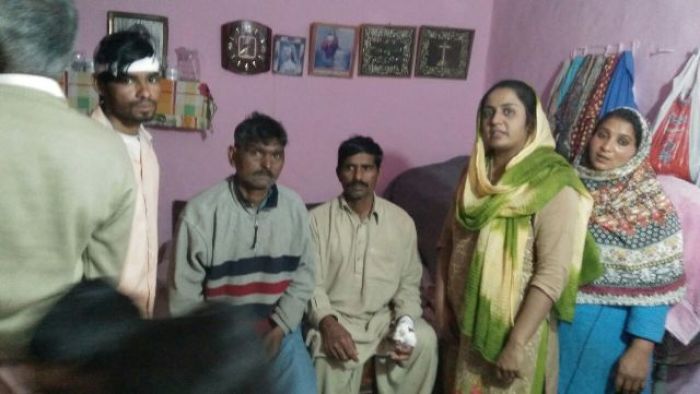 BPCA officer Grace poses for pictures with victims of the March 4, 2018 attack on the Pakistani Gospel Assembly in the Punjab province of Pakistan.