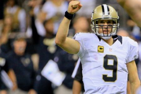 Sep 20, 2015; New Orleans, LA, USA; New Orleans Saints quarterback Drew Brees (9) celebrates a touchdown pass to wide receiver Willie Snead (not pictured) during the second half of a game against the Tampa Bay Buccaneers at the Mercedes-Benz Superdome. The Buccaneers defeated the Saints 26-19.