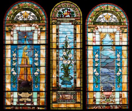 Light shines through the stained glass windows at Acton Congregational Church in Acton, Massachusetts.