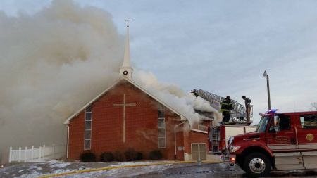 Firefighters work to put out a fire that destroyed the Antioch Baptist Church in Hannibal, Missouri on Dec. 20, 2016.