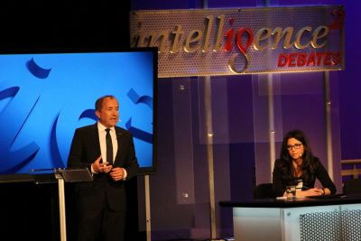 Michael Shermer (L), founder of The Skeptics Society and his debate partner Heather Berlin, a cognitive neuroscientist (R) explain why 'The More We Evolve, the Less We Need God' at an Intelligence Squared debated in New York City on March 27, 2018.