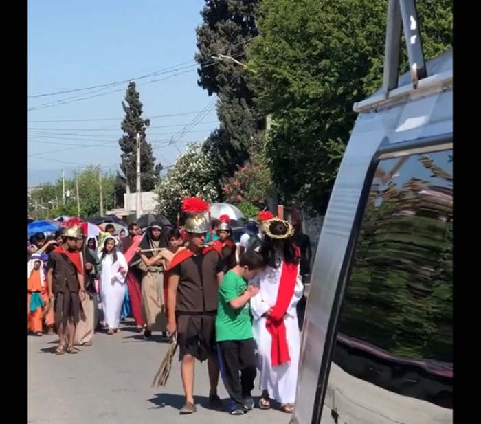 A Down syndrome boy hugging a Jesus actor during the Stations of the Cross in Monclova, Mexico, on March 30, 2018.