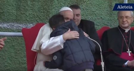 The Vatican's Pope Francis embracing a boy who asked him a question about Heaven on April 15, 2018.