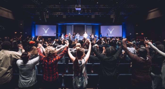 A Sunday evening service at Worship With Wonders Church, based in the Atlanta, Georgia area. In April 2018, a county board voted to approve the church's plan to move into an abandoned shopping center.