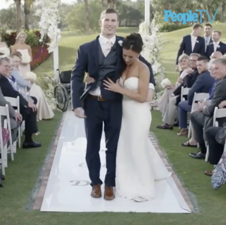 Chris Norton walks his bride Emily down the aisle, Jupiter, Florida April 21, 2018.