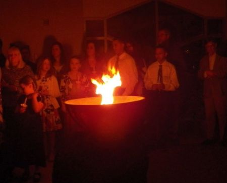 Fire flickers at an Easter vigil held at Holy Spirit Catholic Church in Fargo, North Dakota on March 31, 2018.