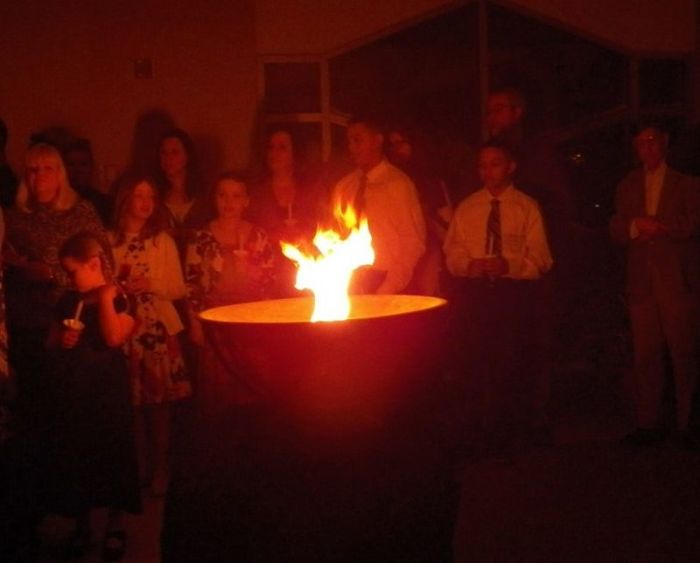 Fire flickers at an Easter vigil held at Holy Spirit Catholic Church in Fargo, North Dakota on March 31, 2018.