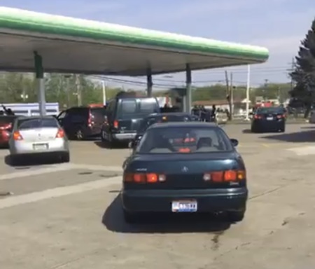 Cars lineup to receive free gas paid for by Victory Christian Center's campus in Liberty Township, Ohio on May 12, 2018.