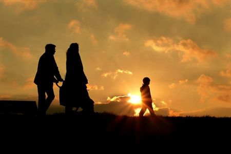 Family walking in the park.