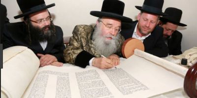 Rabbi Yosef Berger looks on as his Torah for the Messiah is completed.