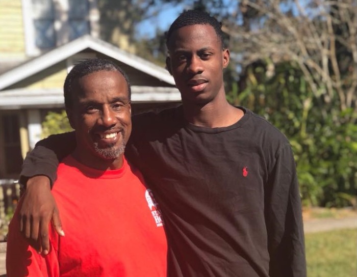 The late Pastor Orlando Rivera, 52, and one of his sons Jamess Rivera, in happier times.